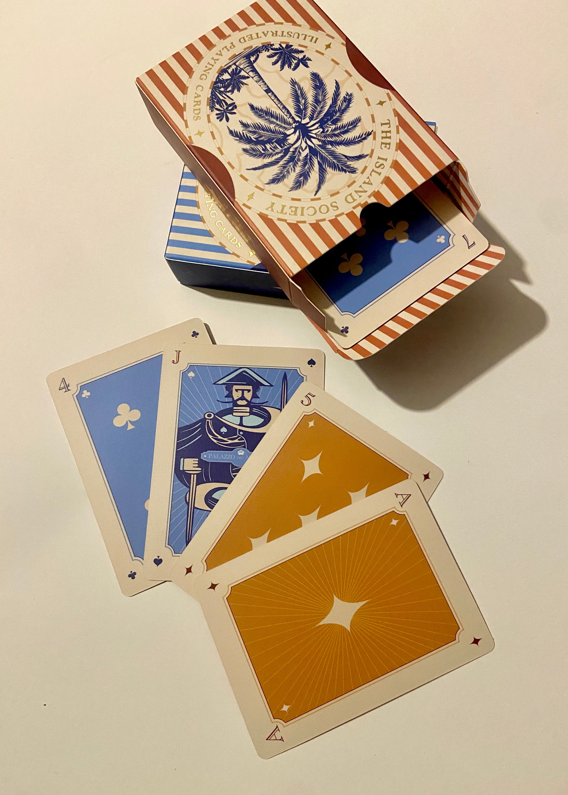 unique premium Playing cards with decorative box on a beige background