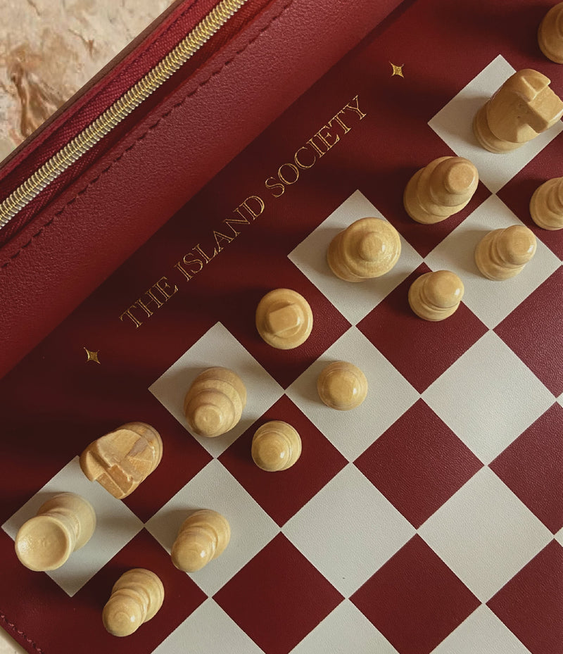Premium chess set on wooden table during slow evening at home for fathers day 